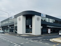 a black and white building on the corner of a street